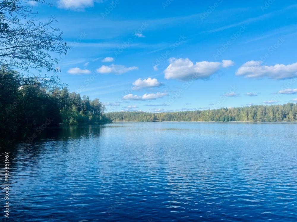 Obraz premium beautiful blue lake view, blue sky with white clouds reflections on the lake surface