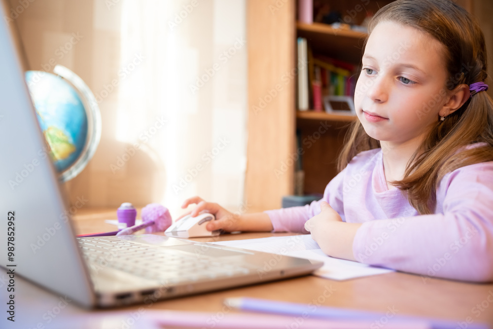 Pretty stylish schoolgirl studying homework math during her online lesson at home, social distance during quarantine,online education concept, home schooler.Online Lesson. Pretty stylish schoolgirl studying homework math during her online lesson at home, social distance during quarantine,online education concept, home schooler.Online Lesson.