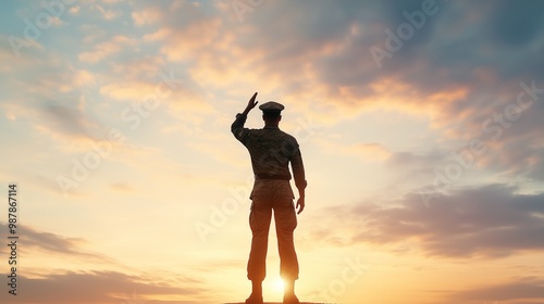 Silhouette of a Soldier in Uniform Saluting at a Sunset Ceremony, Depicting Patriotism and Respect for National Service with a Beautiful Sky Backdrop