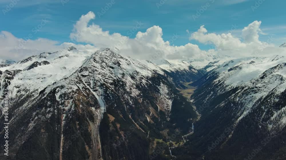 Aerial view of snow mountain range landscape with clouds. Alps mountains, Austria, panorama 4k Aerial view of snow mountain range landscape with clouds. Alps mountains, Austria, panorama 4k