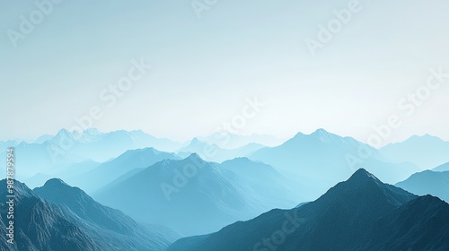 Breathtaking panoramic view of misty mountains and lush valleys under a bright blue sky during the day