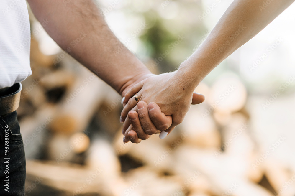 Bride and groom, newlyweds in love holding hands outdoors. Wedding photography. Bride and groom, newlyweds in love holding hands outdoors. Wedding photography.