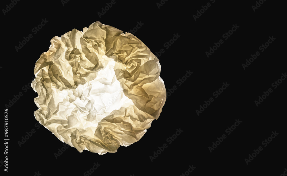 circle of crumpled paper on a dark background circle of crumpled paper on a dark background