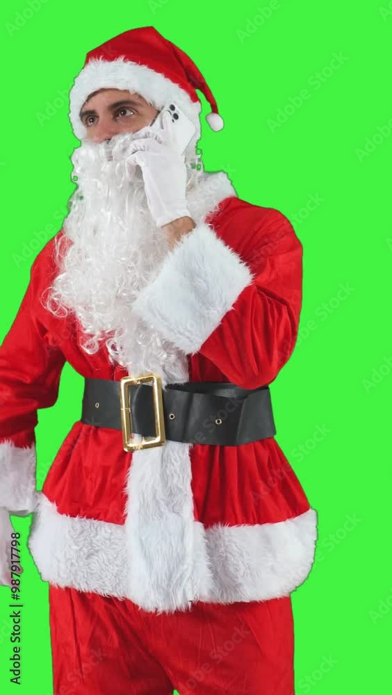 vertical Santa Claus making a phone call with his smartphone chroma key vertical Santa Claus making a phone call with his smartphone chroma key