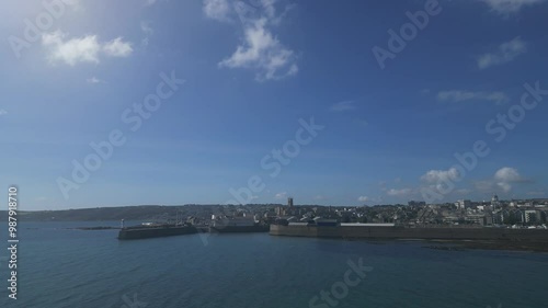 Penzance, Cornwall, England: DRONE VIEWS: The drone circles Penzance harbour showing the town and coastline. The mainline railway terminates at Penzance, which is a popular UK holiday destination (6). photo