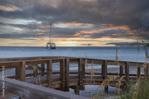 The beach access ramp across the morning sky and a communications tower Fort DeSoto Park St Petersburg Florida September 2024