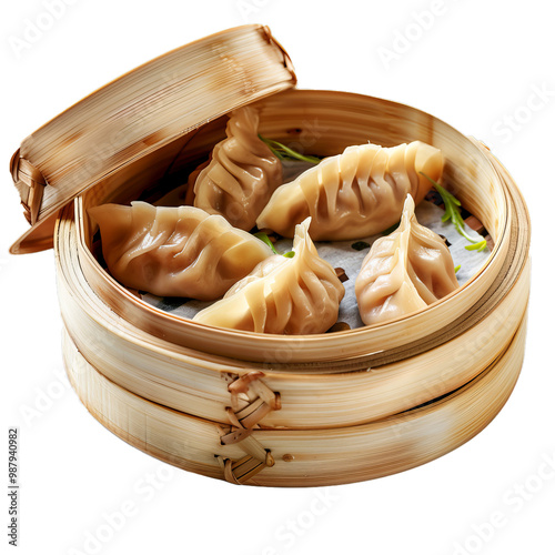 Steamed pork dumplings are served in a bamboo steamer, showcasing a popular asian cuisine delicacy photo