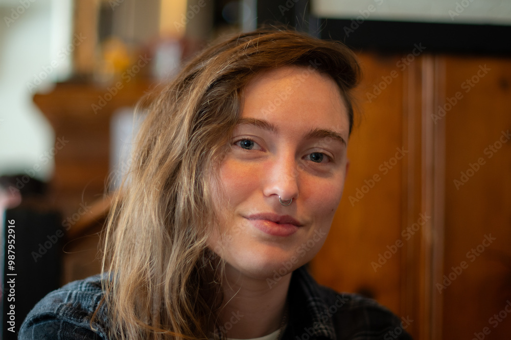 portrait of a young beautiful woman with long hair smiling indoors, light makeup. portrait of a young beautiful woman with long hair smiling indoors, light makeup.