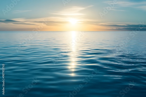 Peaceful sunrise over calm ocean water with sun reflection. Tranquil seascape with sun rays. Horizon