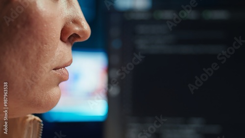 Extreme closer up shot of happy computer engineer satisfied after futureproofing company network from system failures. Smiling IT worker pleased after managing to increase data security, camera B photo