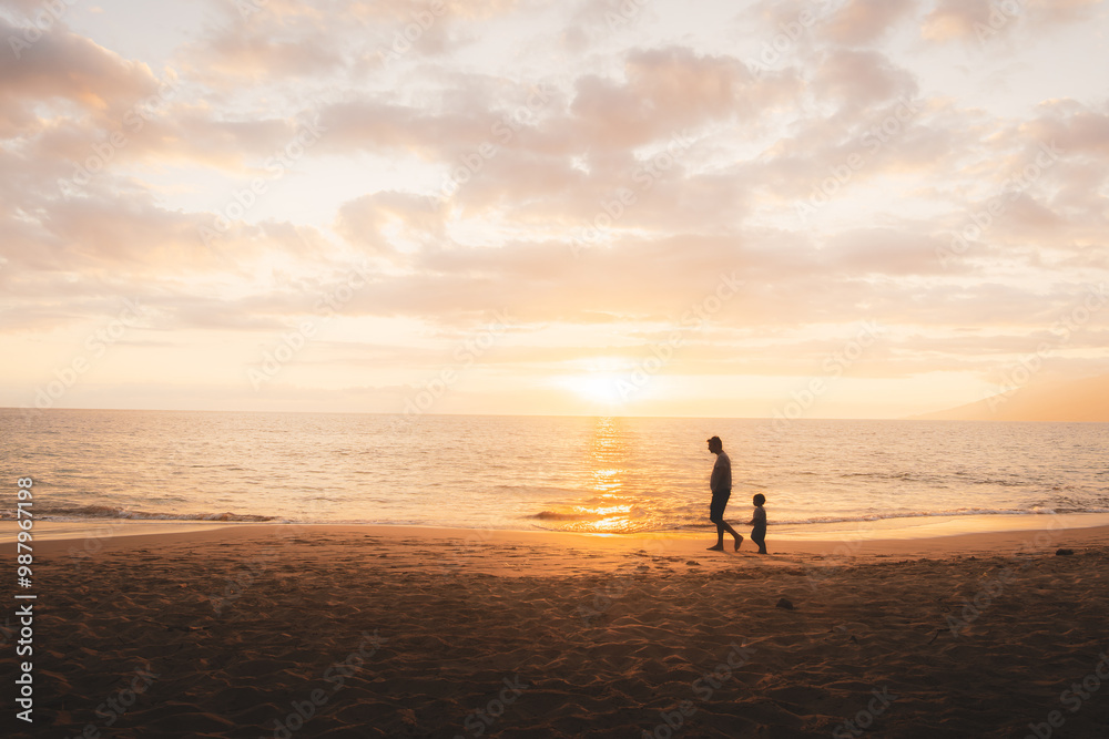 Parent and Child on the Beach at Sunset Parent and Child on the Beach at Sunset