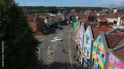 Drone view of North Street, Southville, Bristol, featuring colourful street art and local businesses
