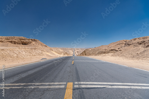 Close up on the concrete path of the highway connecting Qinghai and Xinjiang in China photo