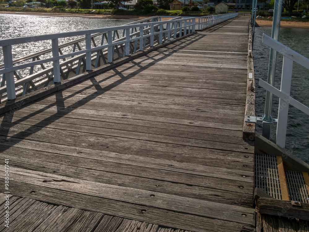 Obraz premium View Along Rustic Wooden Decked Pier