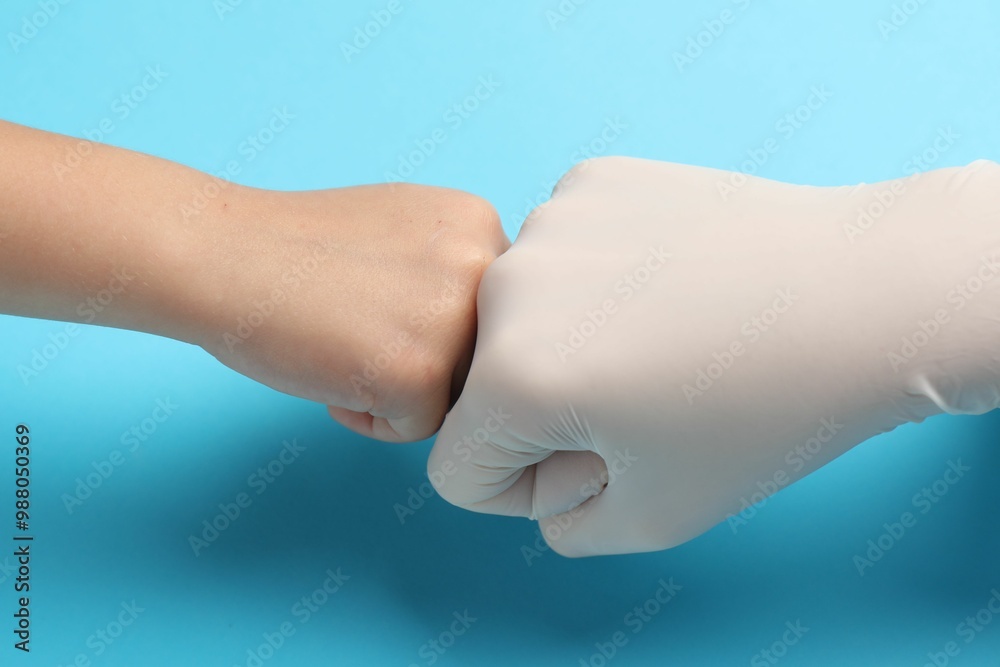 Doctor and child on light blue background, closeup Doctor and child on light blue background, closeup