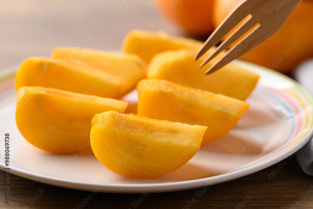 Sliced ripe persimmon ready to eating, Autumn fruit Sliced ripe persimmon ready to eating, Autumn fruit