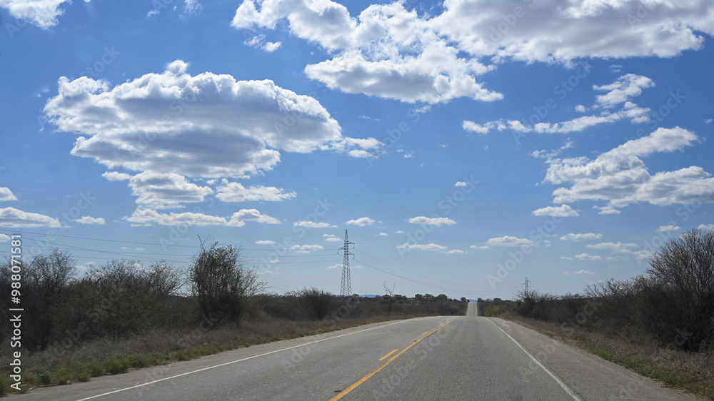 road with blue sky clear day paved highway with farms vegetation mountains clouds road with blue sky clear day paved highway with farms vegetation mountains clouds