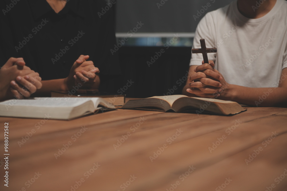 Obraz premium Christian group are praying to god with the bible and sharing the gospel. Concept of faith for god.
