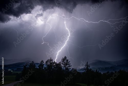lighting at a heavy thunderstorm in the bavarian alps near Siegsdorf, Chiemgau, Bavaria, Germany