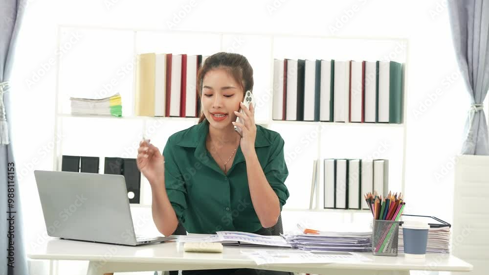 Asian businesswoman doing tax, accounting, statistics and analysis research using laptop computer and working in office with calculator on desk with documents, planning, analyzing financial report. Asian businesswoman doing tax, accounting, statistics and analysis research using laptop computer and working in office with calculator on desk with documents, planning, analyzing financial report.