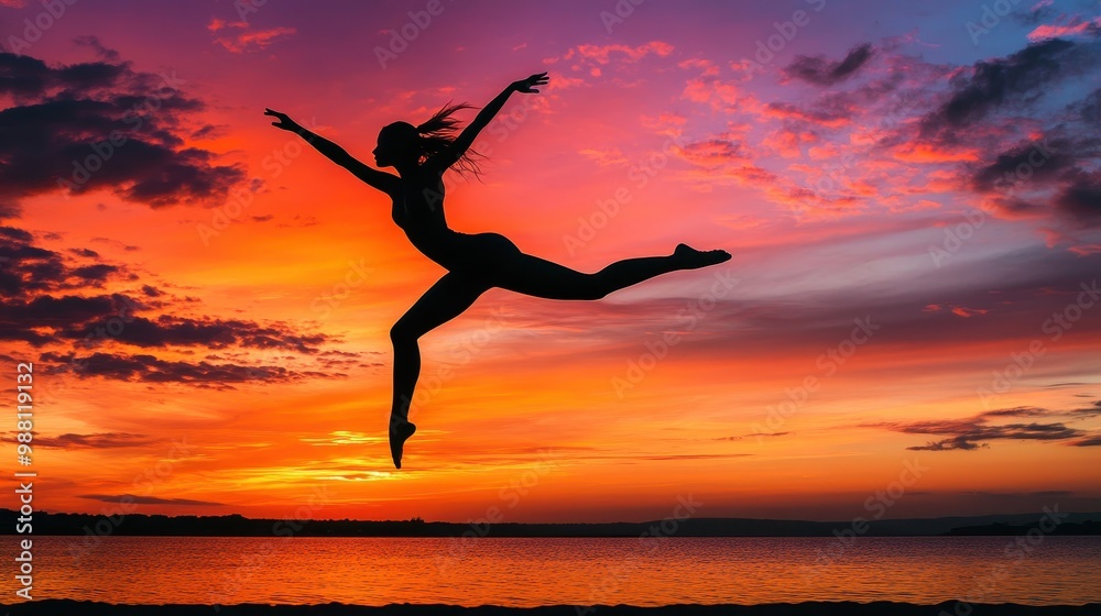 Silhouette of a Woman Jumping Against a Vibrant Sunset Over a Lake. Silhouette of a Woman Jumping Against a Vibrant Sunset Over a Lake.