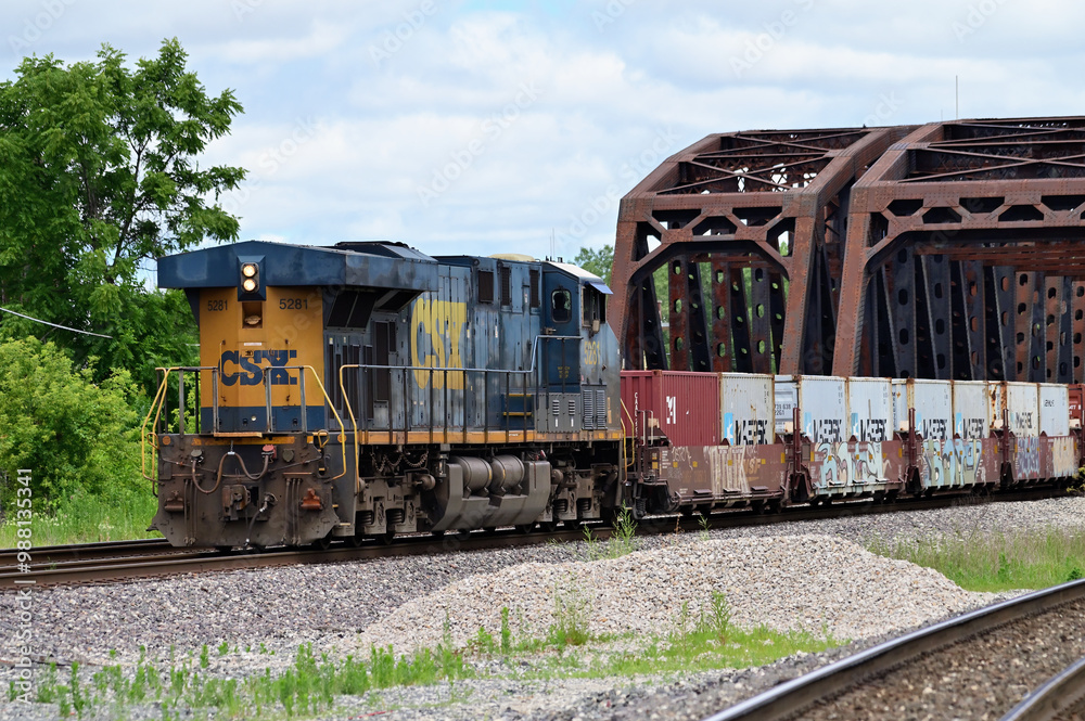 A CSX Transportation locomotive, functioning as a rear-train ...