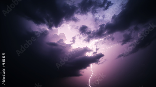 A dramatic sky with dark, heavy rain clouds and visible streaks of rain falling towards the ground. The scene includes distant lightning flashes, creating a powerful and dynamic background that convey photo