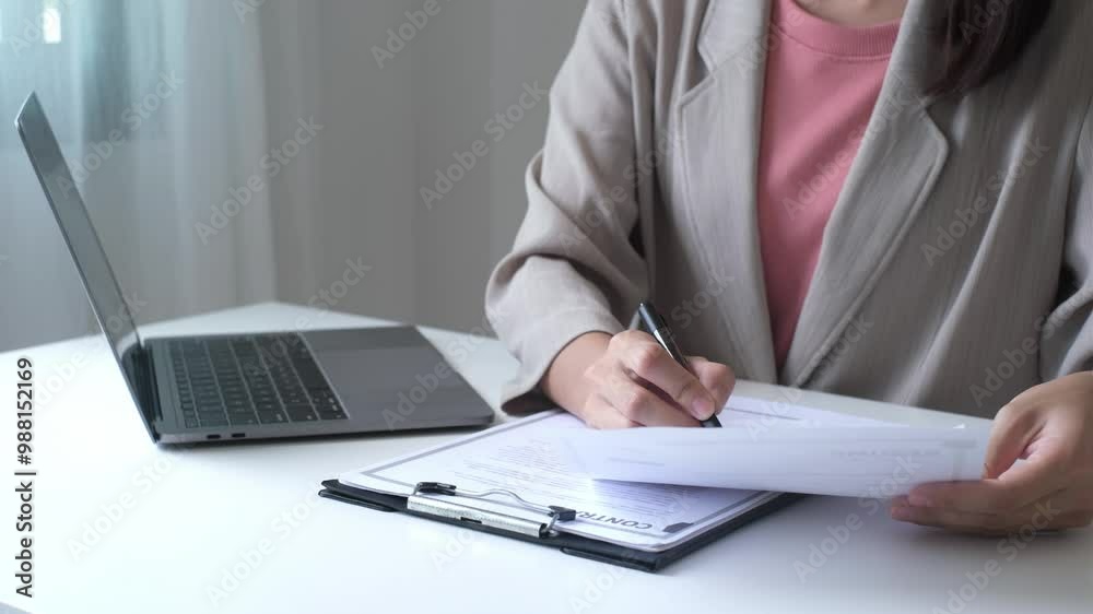 Executive CEO businesswoman checking job applicant documents resumes, interviews, and signing to approve the contract in the office room.
