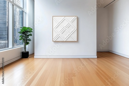 A bare wall with one geometric artwork, providing a focal point in an otherwise empty minimalist room