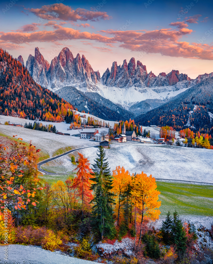 First snow covered green hills on Santa Magdalena village. Fabulous autumn view of Seceda peak. Unbelievable landscape of Dolomite Alps, Italy. Traveling concept background.