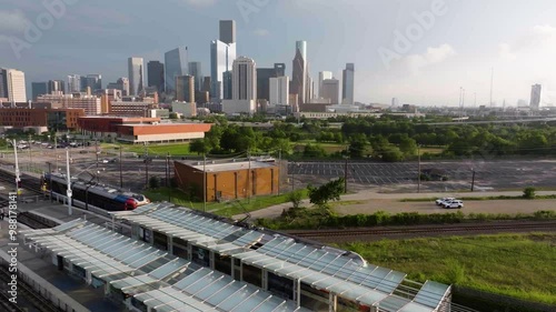 Aerial view of the Metro leaving the station with downtown Houston background photo