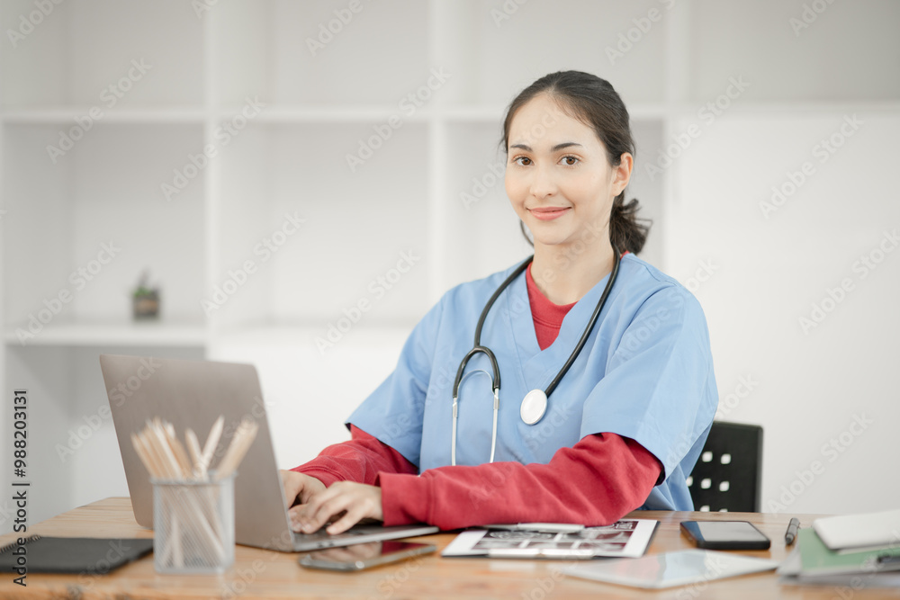 Young female doctor sitting and reading patient history Young female doctor sitting and reading patient history