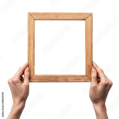Hands holding a wooden frame.