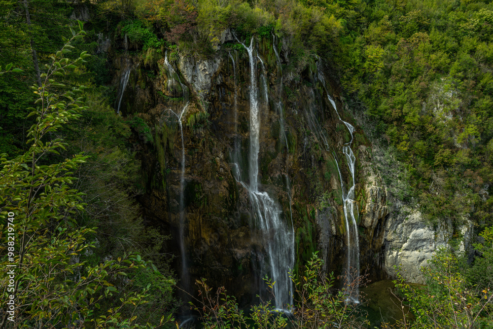 Beauty in spring nature, amazing waterfall in forest. Waterfall and pond. Panoramic beautiful deep forest waterfall. Beautiful view to waterfalls with green forest. The tranquil waters of waterfalls. Beauty in spring nature, amazing waterfall in forest. Waterfall and pond. Panoramic beautiful deep forest waterfall. Beautiful view to waterfalls with green forest. The tranquil waters of waterfalls.