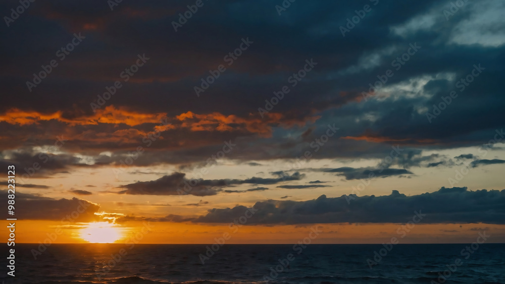 Sunset in front of the clouds the sky is over the salt water ocean Sunset in front of the clouds the sky is over the salt water ocean