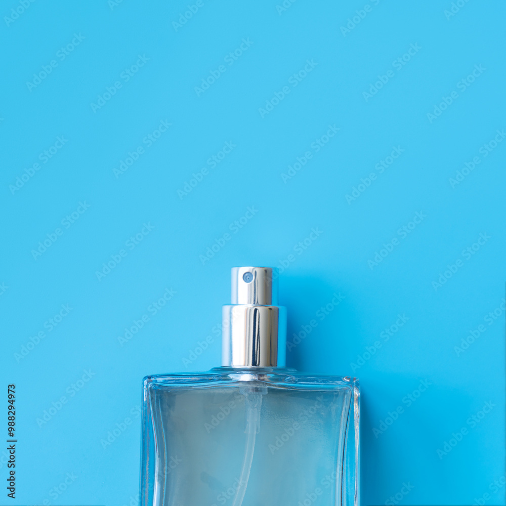 A bottle of perfume lies on a surface. copy space A bottle of perfume lies on a surface. copy space