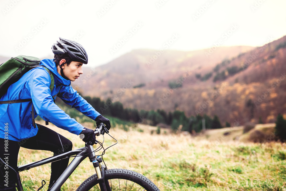 Active man on bike in the middle of beautiful nature, early autumn morning. Concept of healthy lifestyle. Active man on bike in the middle of beautiful nature, early autumn morning. Concept of healthy lifestyle.