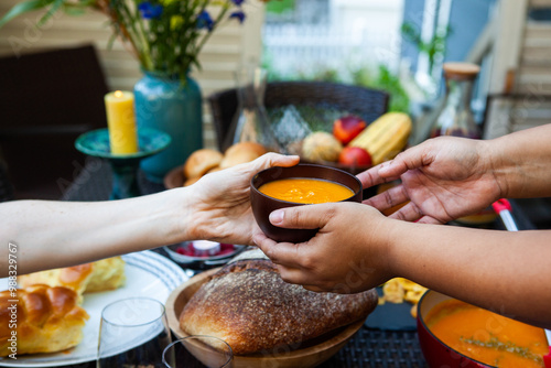 An outdoor autumn picnic with soup and bread photo