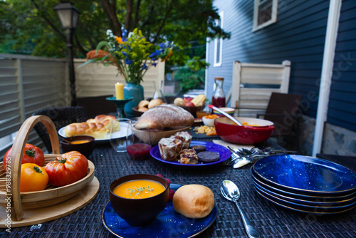 An beautiful table set for dinner outside in late summer photo