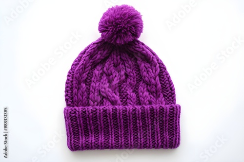 New Purple Knit Wool Hat with Pom Pom isolated Cable-knit hat with pom pom.a beautiful white background.