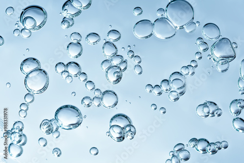 Close up macro Aloe vera gel cosmetic texture blue background with bubbles. Lemongrass gel skincare product. antibacterial liquid with aloe vera, moisturizing. Safe and environmental friendly.