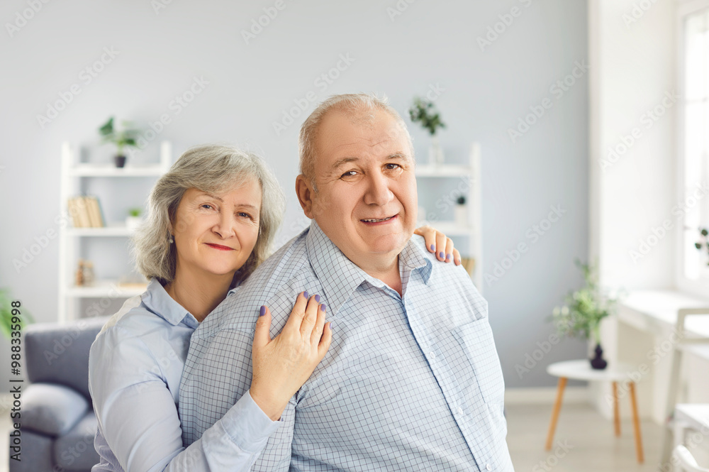 Senior couple portrait, happy retired old man, woman elderly people together at home. Grandparents, healthy nice carefree cheerful husband, wife embracing, dreaming, enjoying wellbeing and love Senior couple portrait, happy retired old man, woman elderly people together at home. Grandparents, healthy nice carefree cheerful husband, wife embracing, dreaming, enjoying wellbeing and love