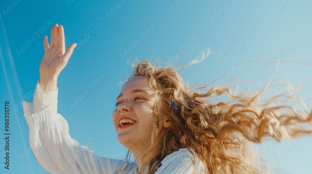Smiling girl against the sky
