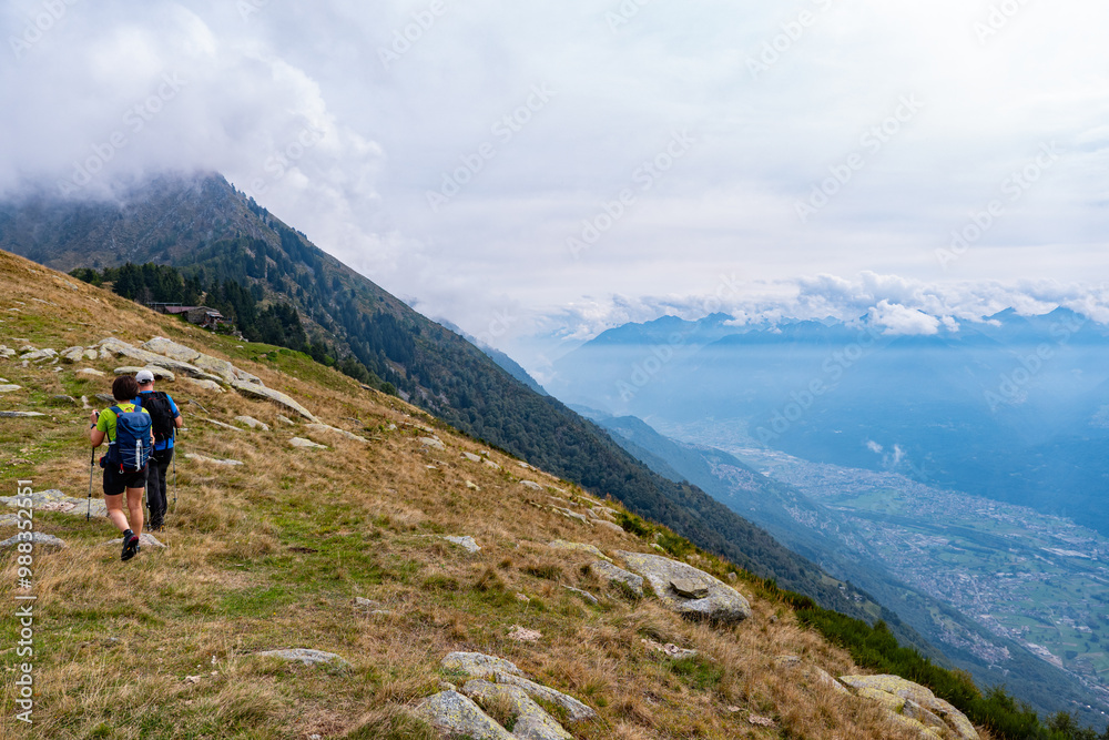 Trekking scene on a mountain between Valtellina and Lake Como Trekking scene on a mountain between Valtellina and Lake Como