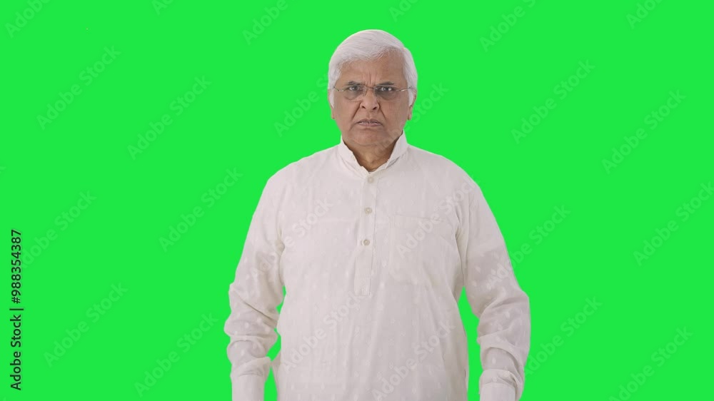 Angry Indian old man looking at the camera Green screen Angry Indian old man looking at the camera Green screen