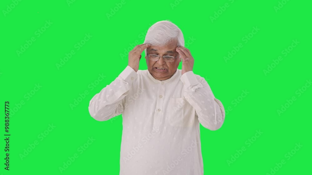 Sick Indian old man having a headache Green screen Sick Indian old man having a headache Green screen