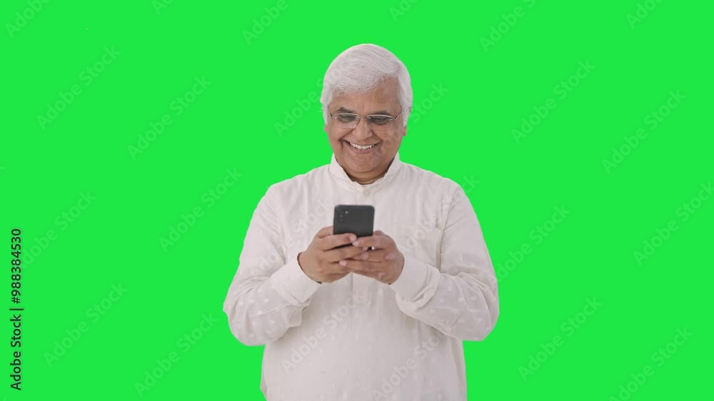 Happy Indian old man chatting on phone Green screen Happy Indian old man chatting on phone Green screen