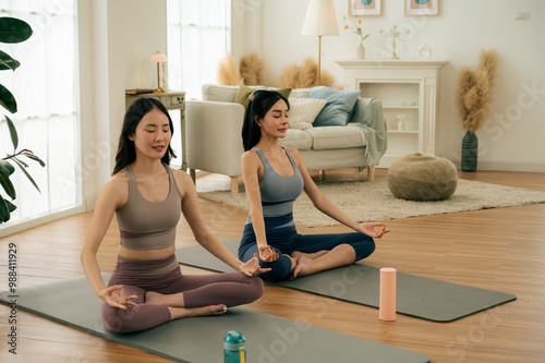 Wallpaper Mural Asian girl doing yoga at home with her friends.concept health care and activity. Torontodigital.ca