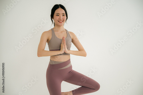 Asian woman yoga routine at Yoga studio