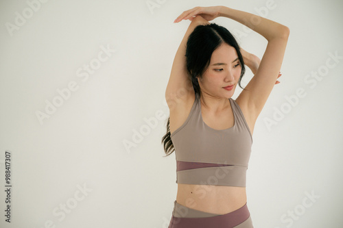 Asian woman yoga routine at Yoga studio